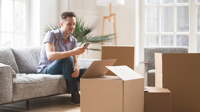 Man packing boses to move house